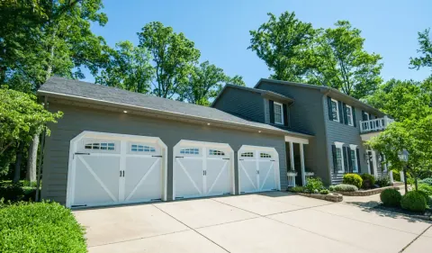 Safe-Way Aristocrat carriage doors across a three-car garage