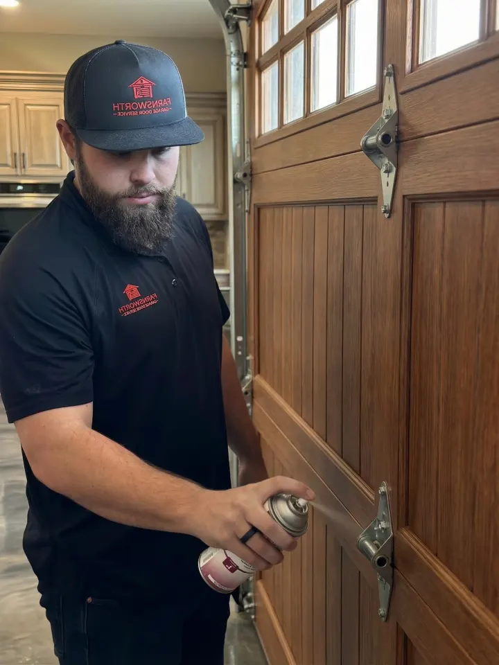 Brigham Farnsworth oiling a garage door