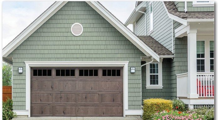 Classic Safe-Way Plank Wood Grain garage door shown on a home