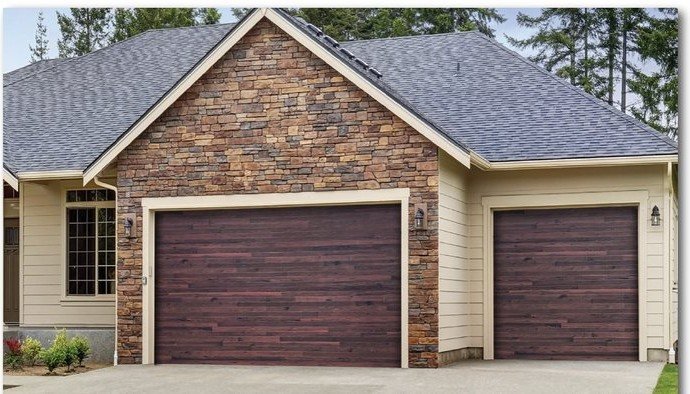 Mahogany Safe-Way Plank Wood Grain garage door shown on a home